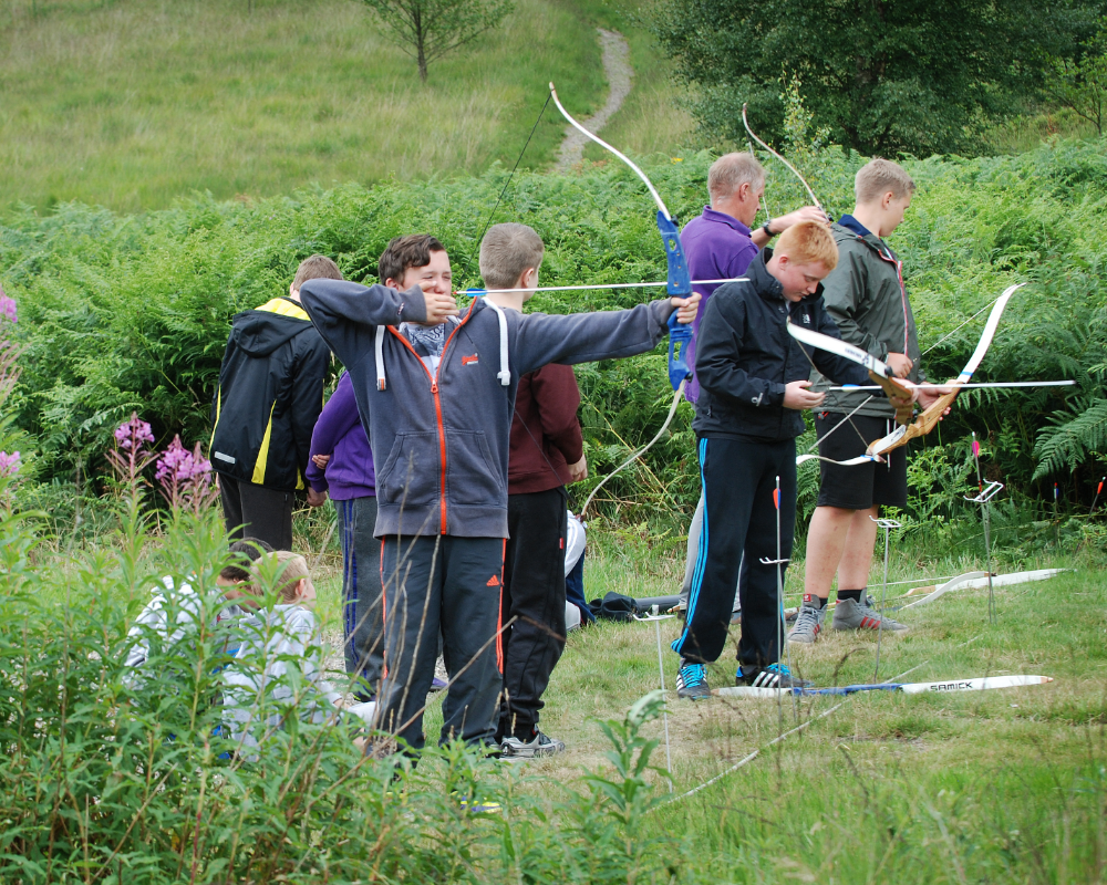 Kids performing Archery