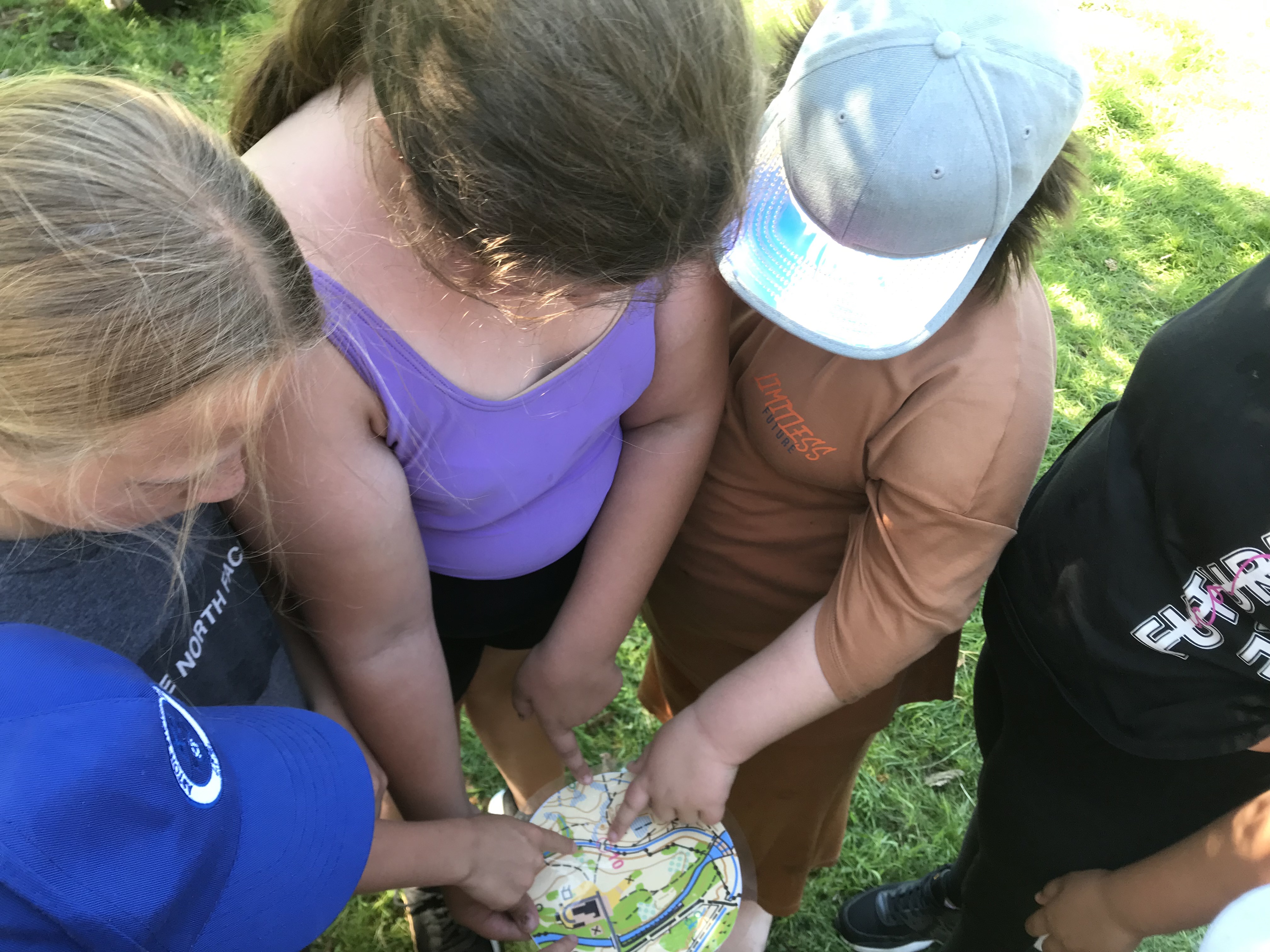 Girl youths analysing a map